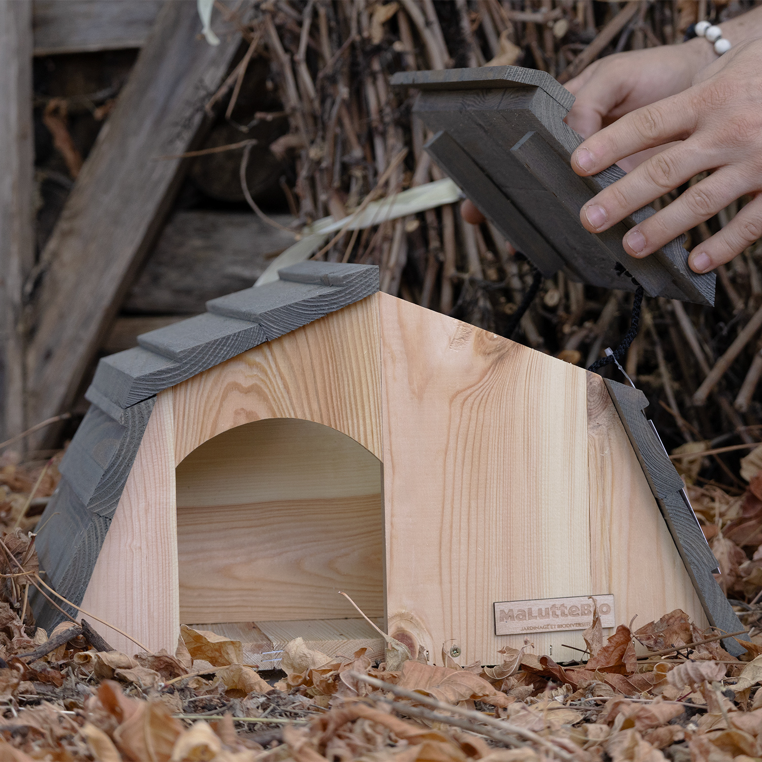 Pine wood hedgehog shelter seen from the front, anti-predator entrance 11 x 14 cm